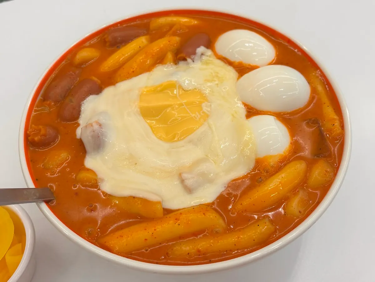 Self-serve bar stocked with pickled radish and broth