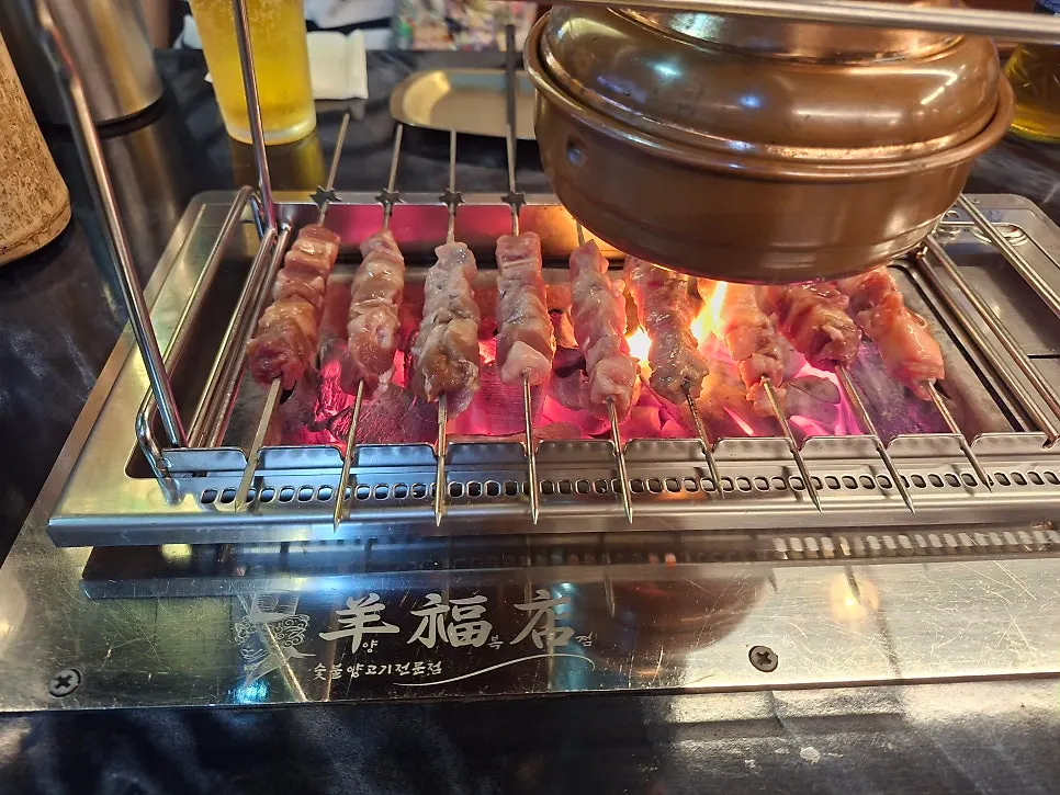 Golden brown grilled lamb skewers at Yangbokjeom Dongdaegu Station Branch
