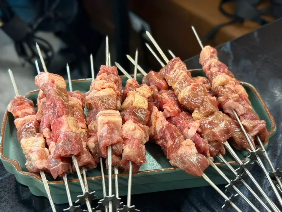 Wangkkochi and lamb loin skewer served together