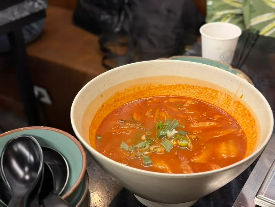 A bowl of onmyeon in spicy broth