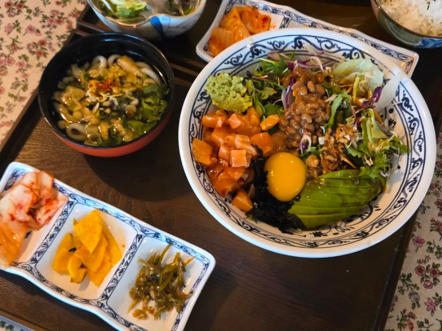 Wellbeing rice bowl topped with avocado and salmon