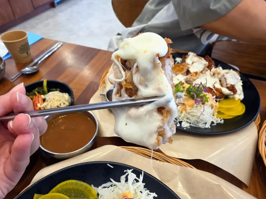 Cross-section of the crispy pork cutlet and mozzarella cheese