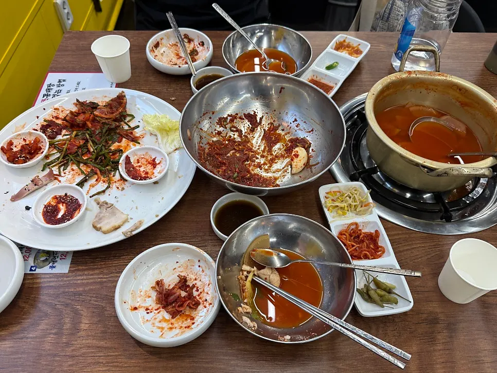 The full set with pollack stew, squid bossam, and naengmyeon served together