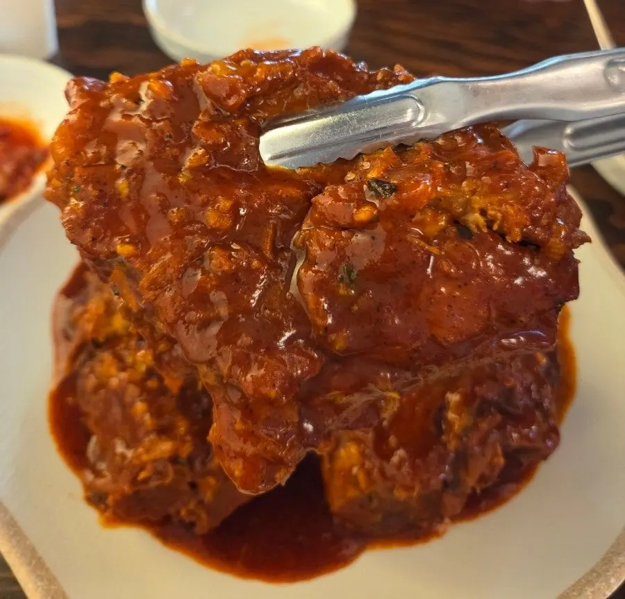 Ppyeo-jjim meat served together with a rice ball