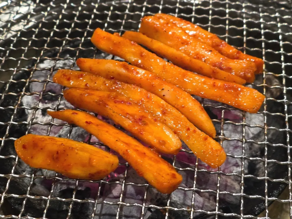 Grilled deodeok eaten with dakgalbi