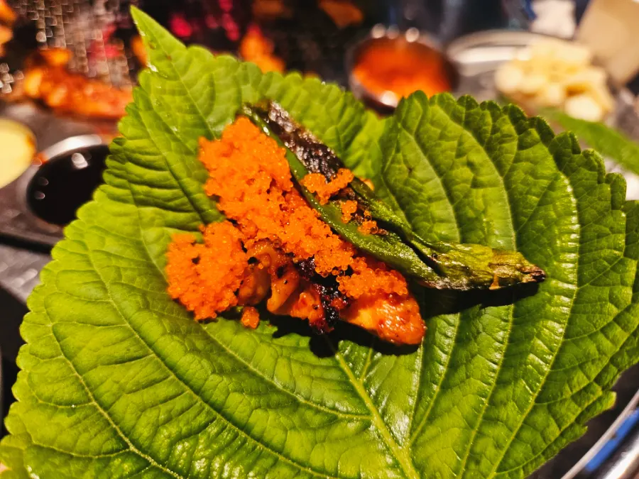 Gochujang dakgalbi wrapped with flying fish roe