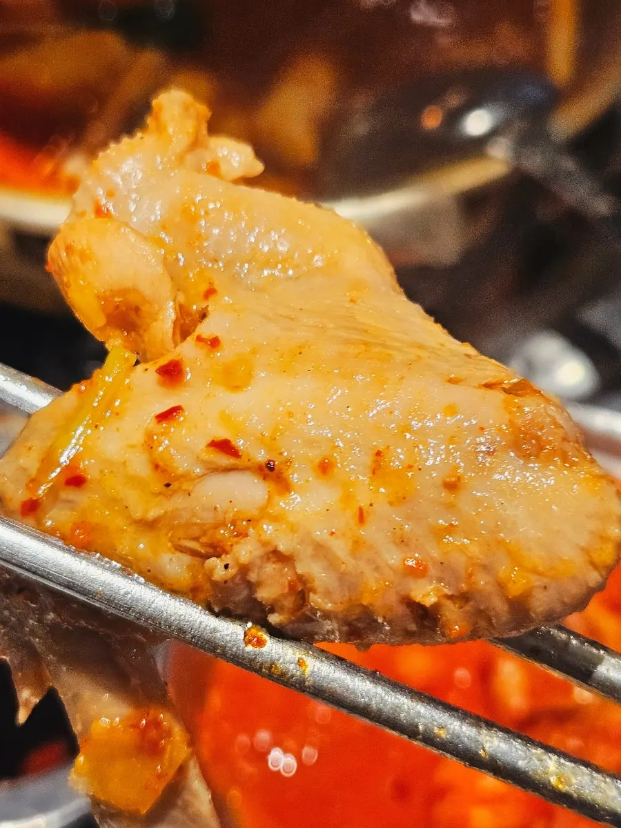 Well-seasoned chicken pieces in dakdoritang