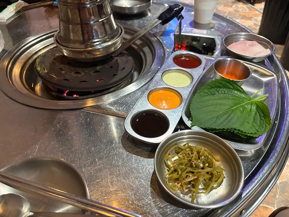 Table setting with side dishes and four kinds of sauce at Yanggyegok