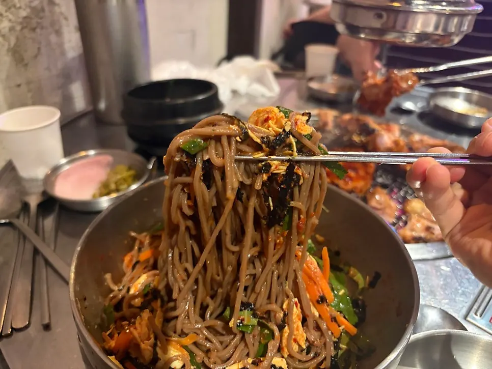 Table setting with deulgye guksu next to the dakgalbi