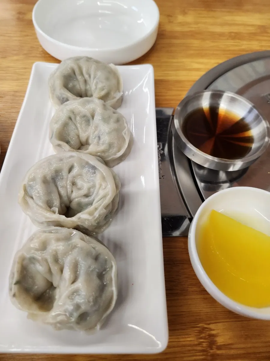 Full table setting with hot buckwheat clam kalguksu