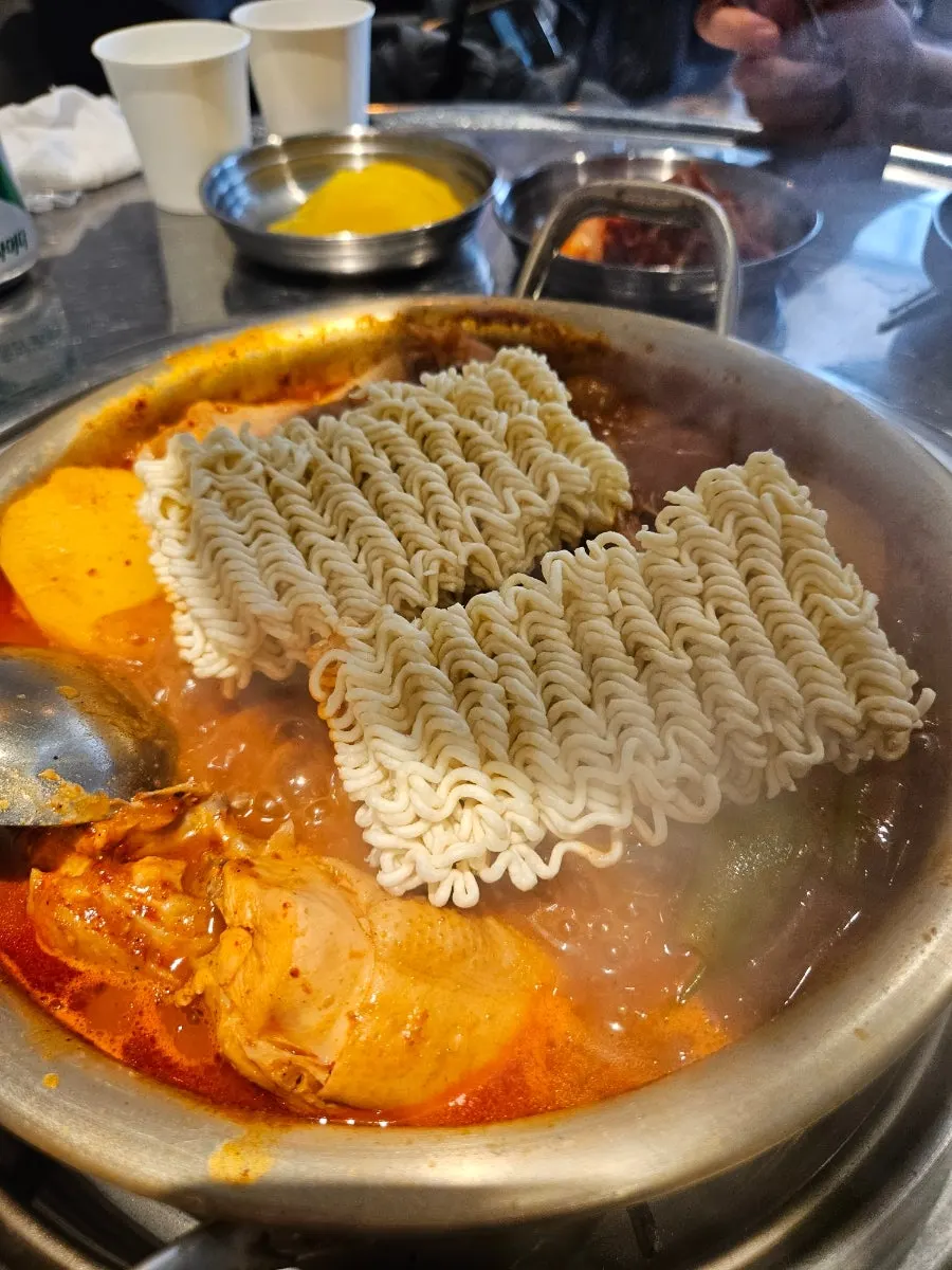 Ramen noodles in dakdoritang with reduced broth