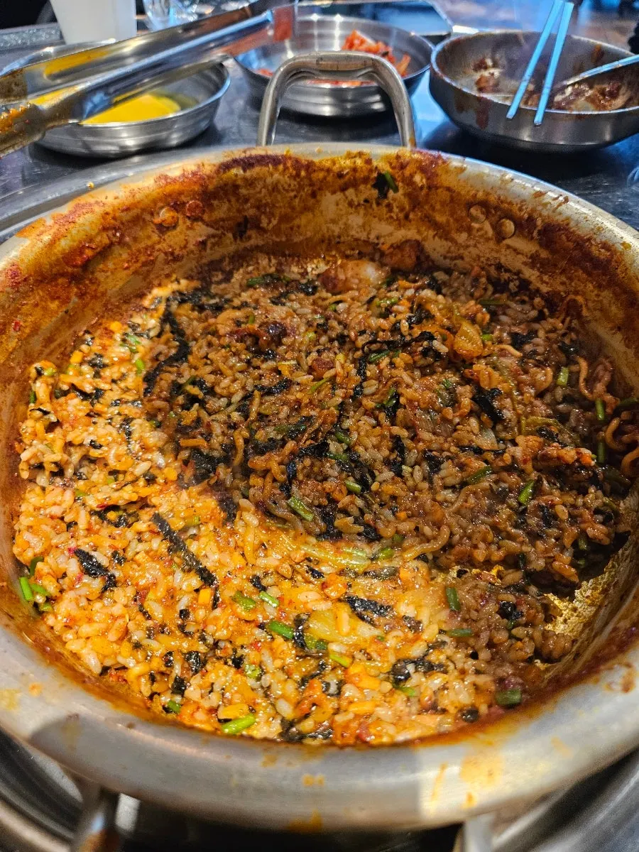 Fried rice laid out flat in a yellow pot