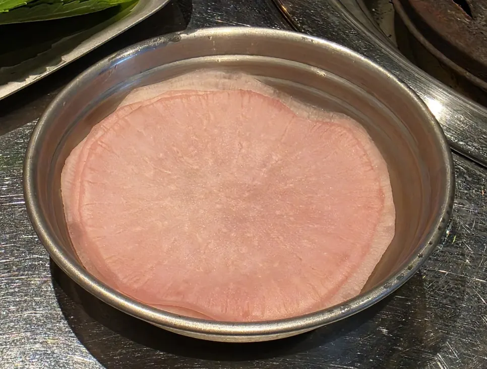 Dakgalbi pairings including pickled radish wraps