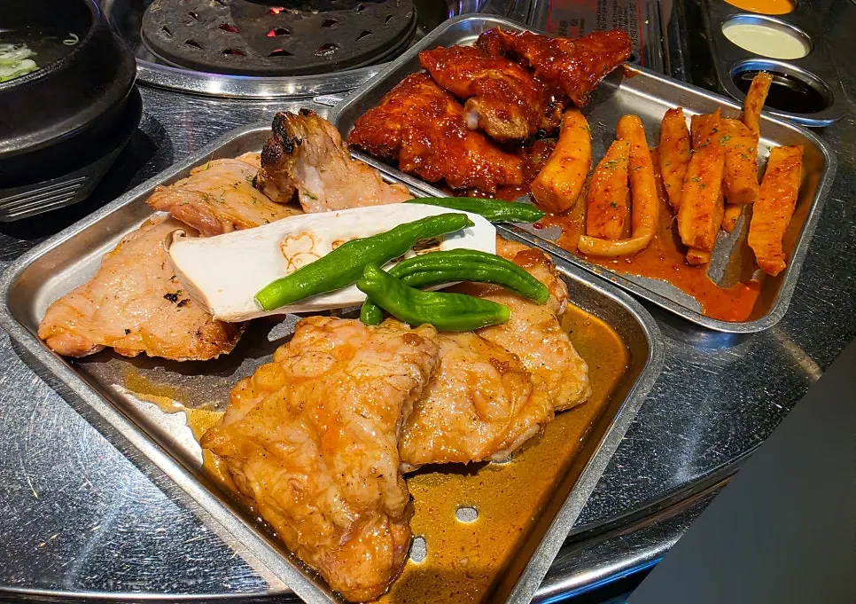 Ordered dakgalbi dishes served at the table