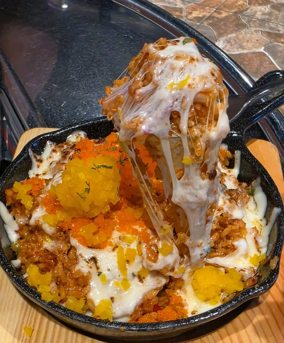 Fish roe fried rice with cheese mixed through the center