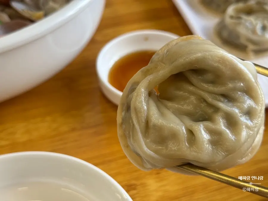 A full kalguksu meal with white kimchi