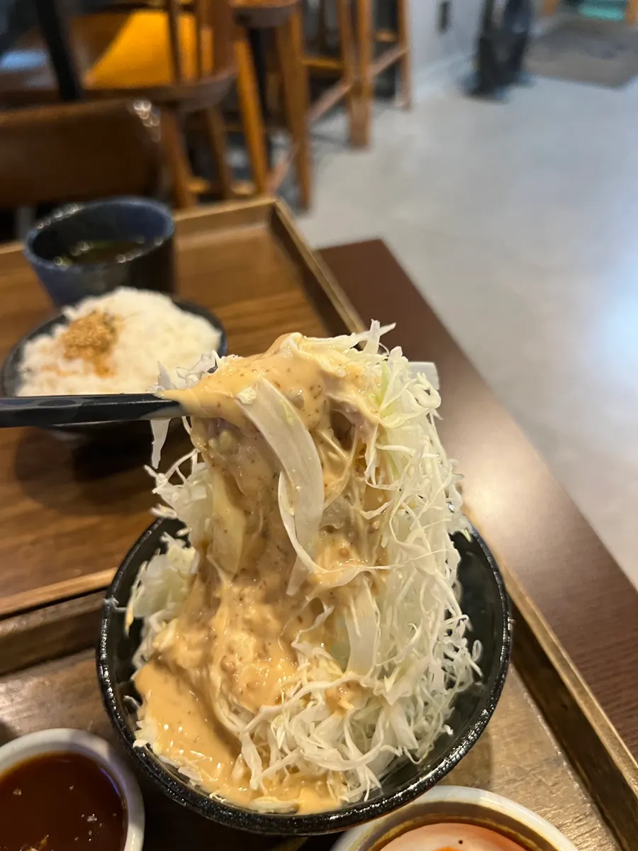 Fried shrimp bitten into, showing its white flesh