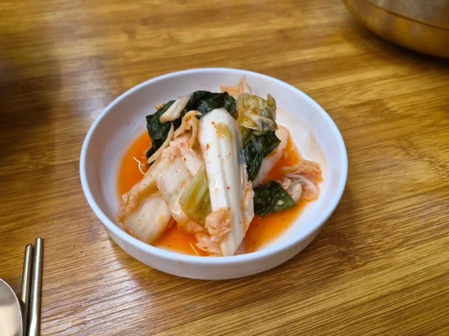 Watery-style kimchi served alongside the kalguksu