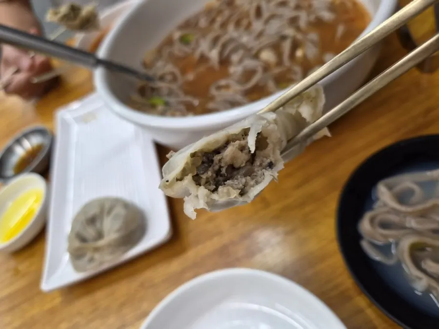 Lifting up a serving of buckwheat noodles