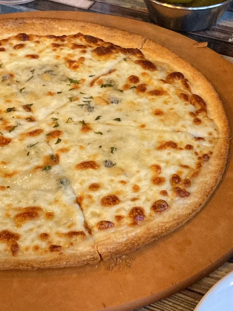Thin-crust gorgonzola pizza with honey