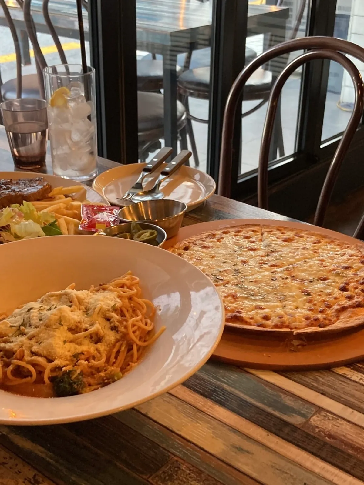 Pasta and pizza together on the table at Pasta Gram Yangjae Main Branch