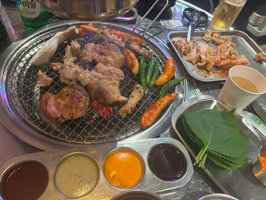 Salted dakgalbi cooking over charcoal