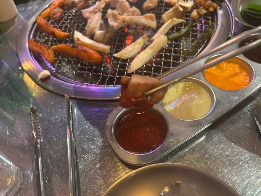 Charcoal dakgalbi paired with the four sauces