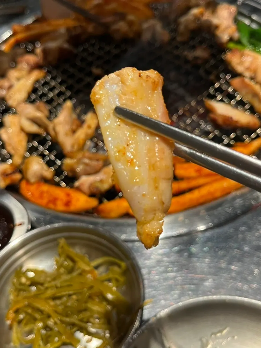 Charcoal-grilled chicken cartilage with meat still attached