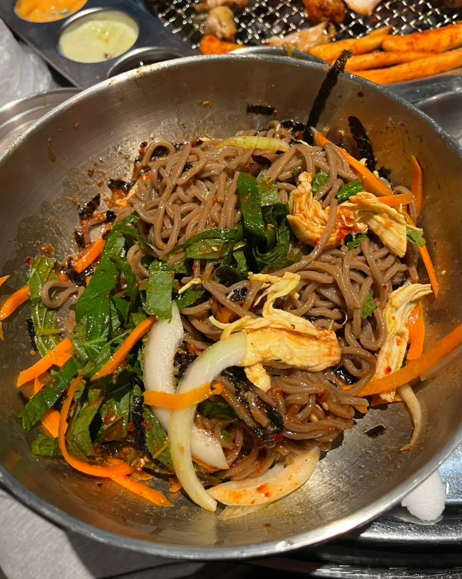 Mixed bibim mak-guksu served alongside the grilled chicken spread