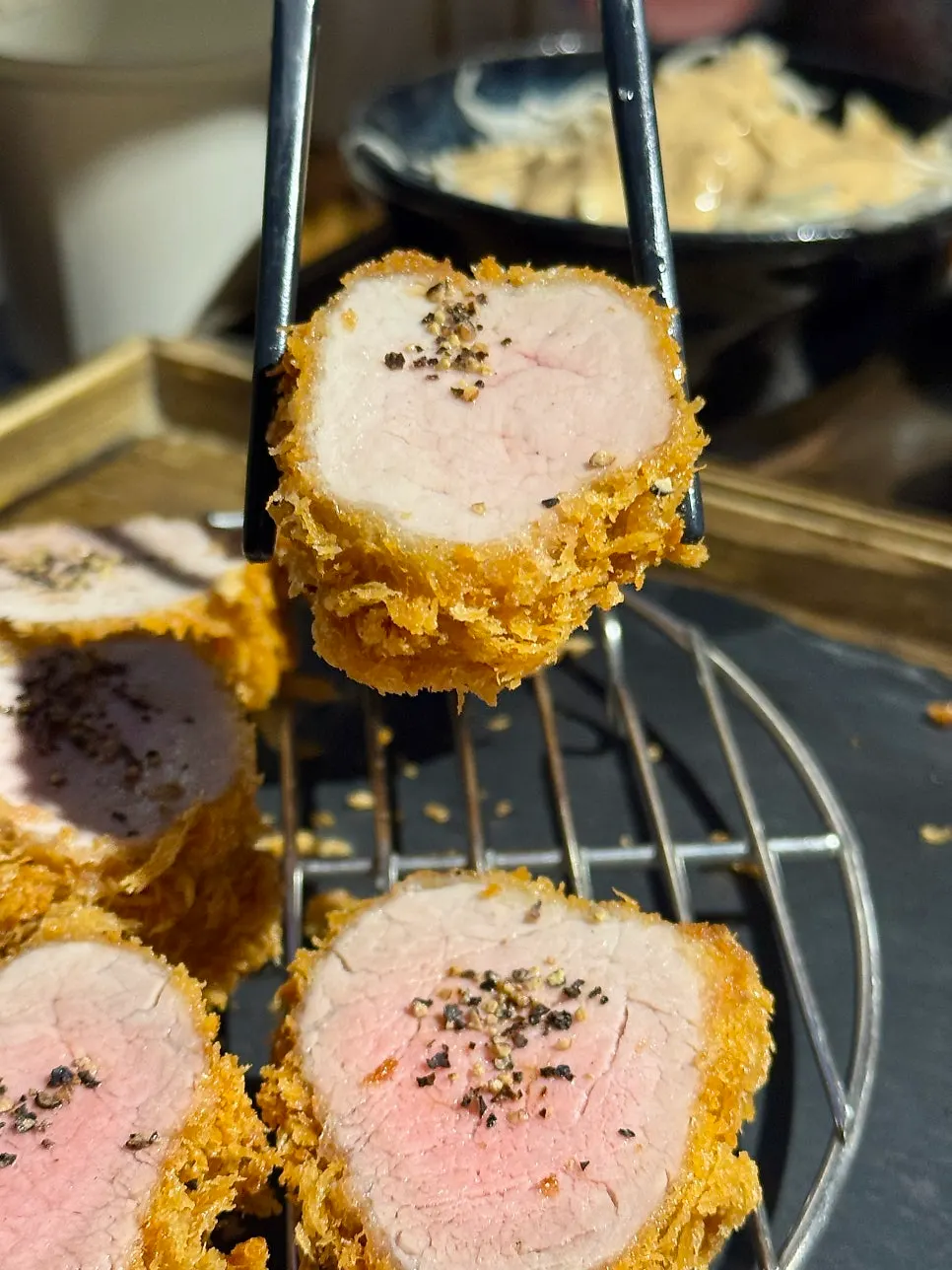 A piece of hire katsu with salt and wasabi