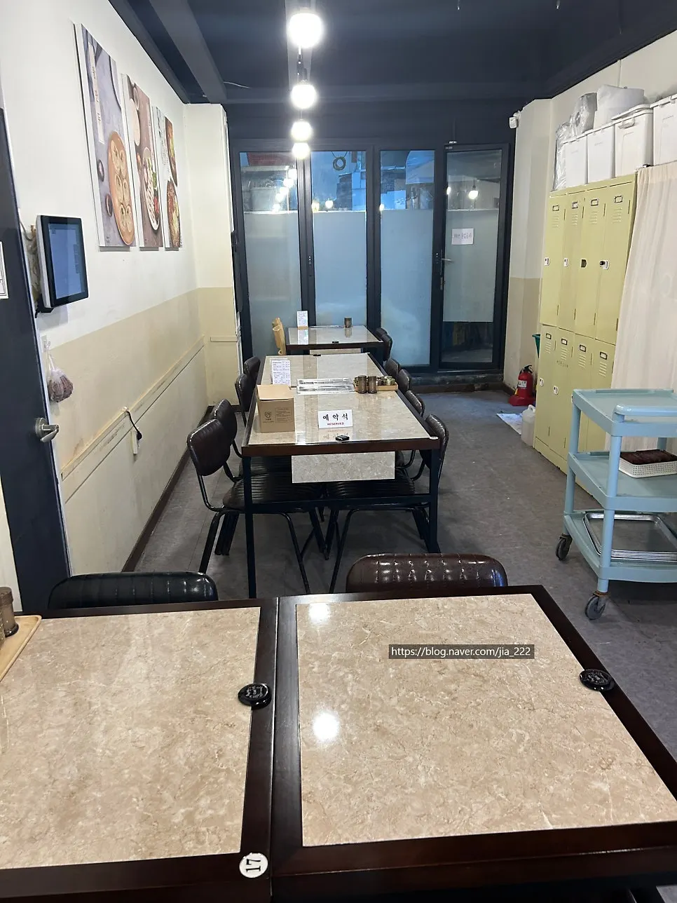 Neatly arranged tables inside Yangjaeok under bright lighting