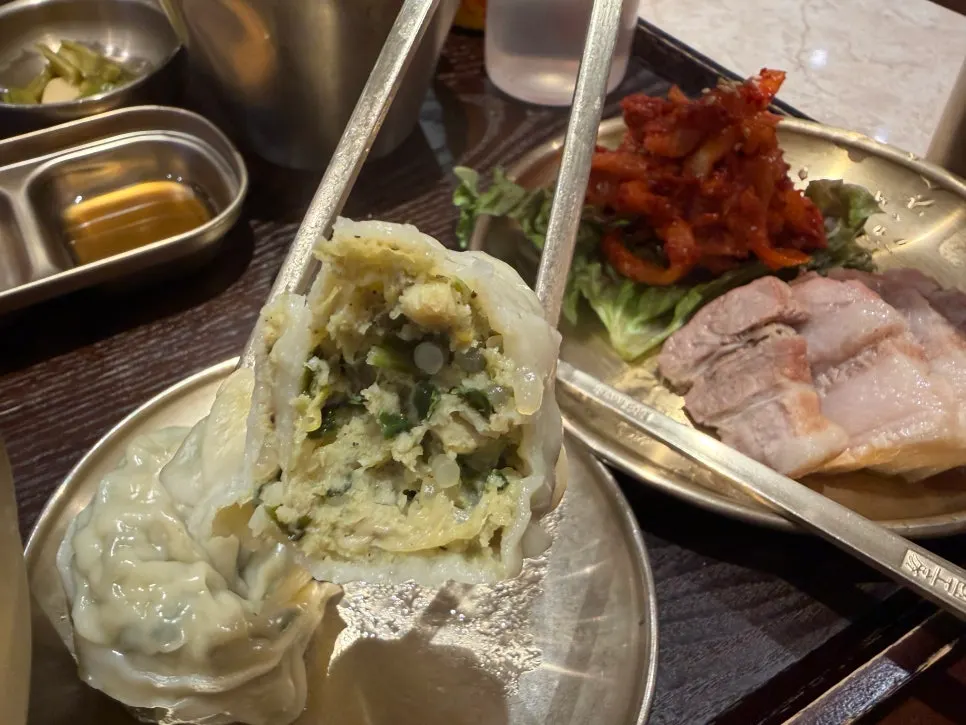 A meat dumpling cut in half showing the filling