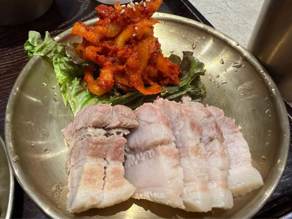 A plate of thickly sliced bossam pork