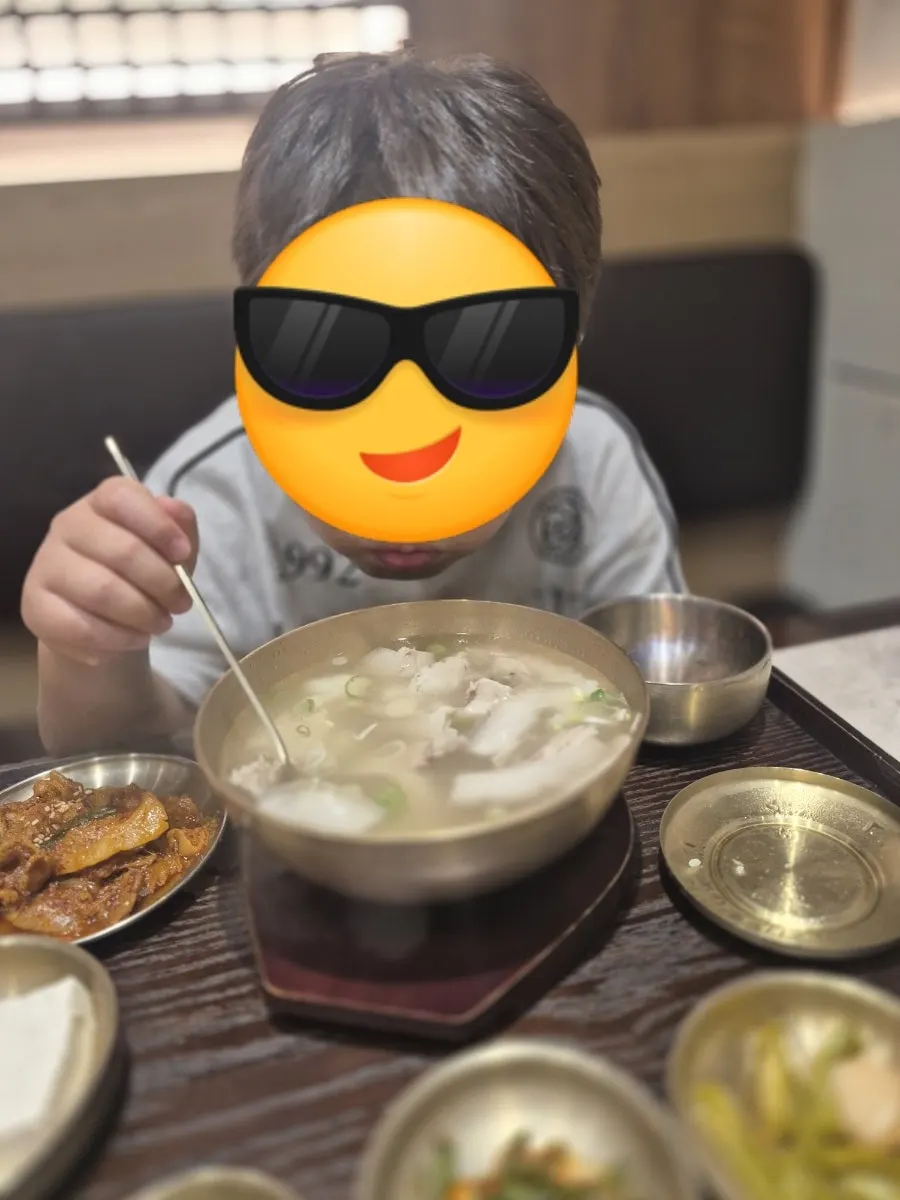A child enjoying the pork gomtang