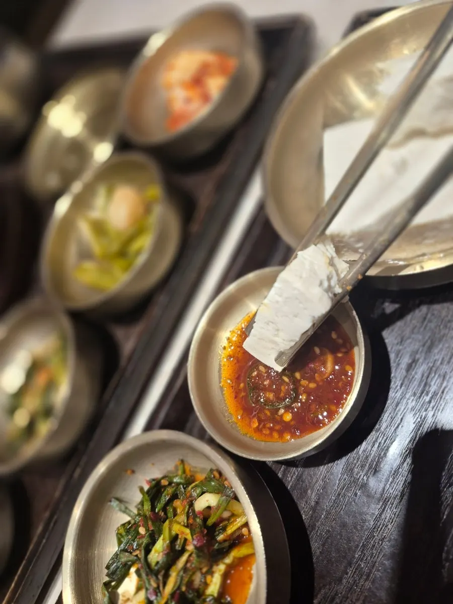 Kimchi and seasoned chives among the basic side dishes
