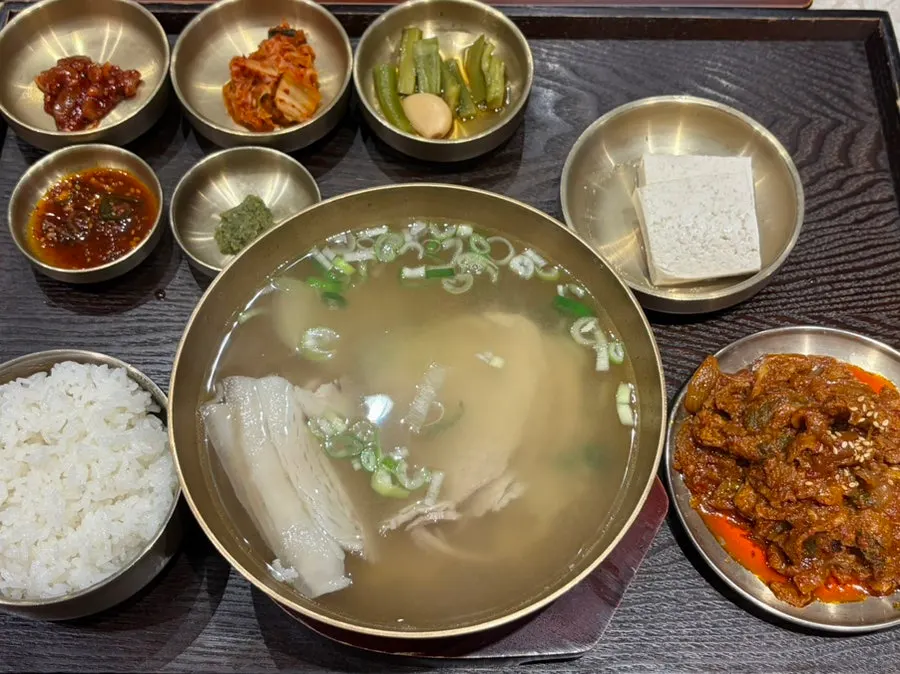 Pork gomtang rice set served in brass bowls as a full spread