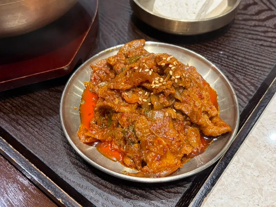 Close-up of pale, tender pork in the pork gomtang