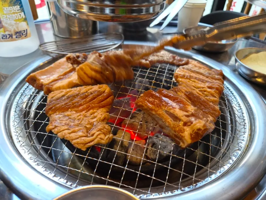 Pork ribs cooking over charcoal