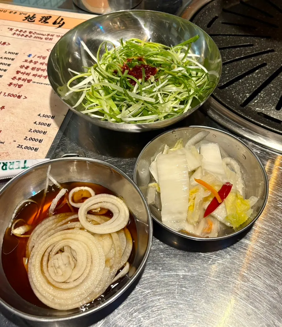 Basic banchan spread with shredded green onion and pickled onion