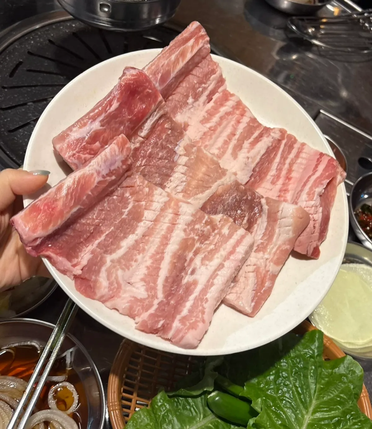 Plate of raw pork ribs and honey marinated ribs before cooking