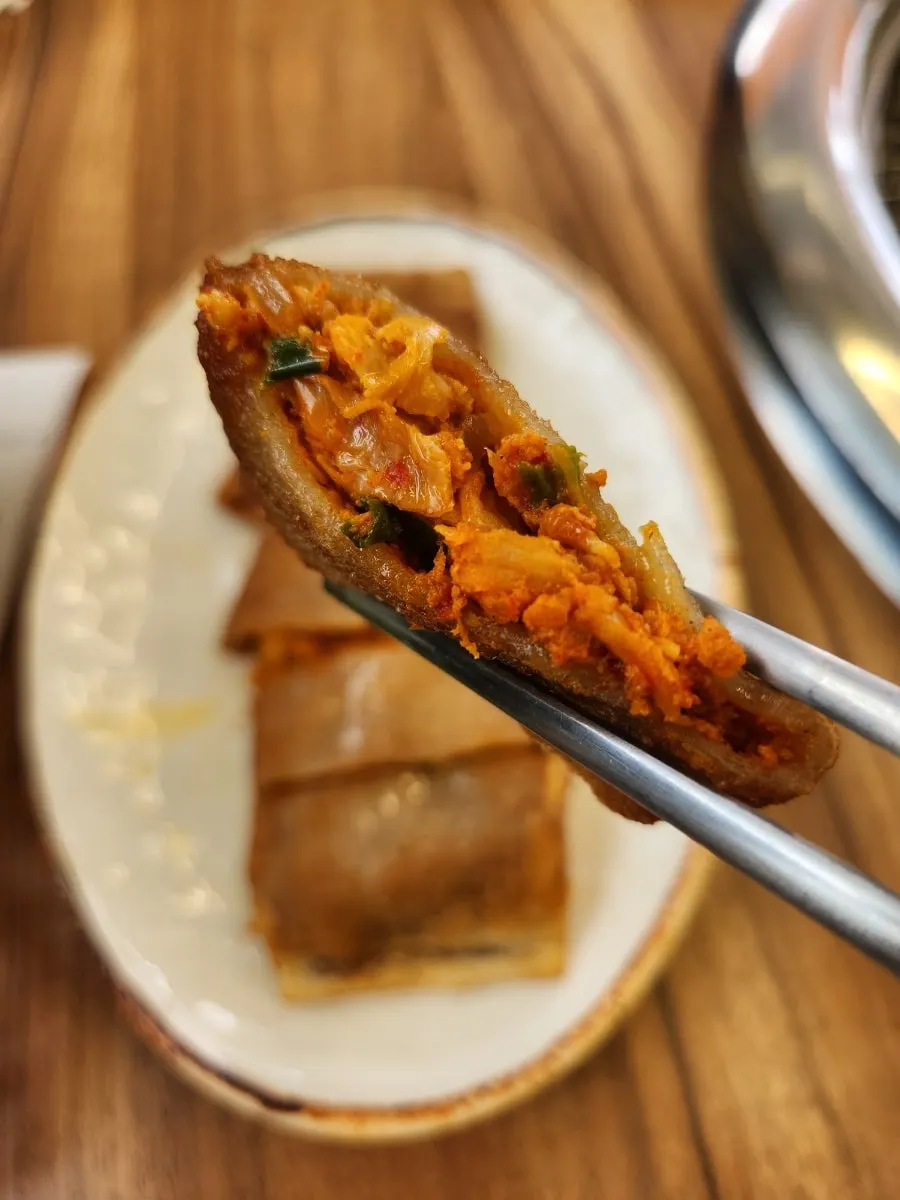 Cross-section of the buckwheat pancake with kimchi filling