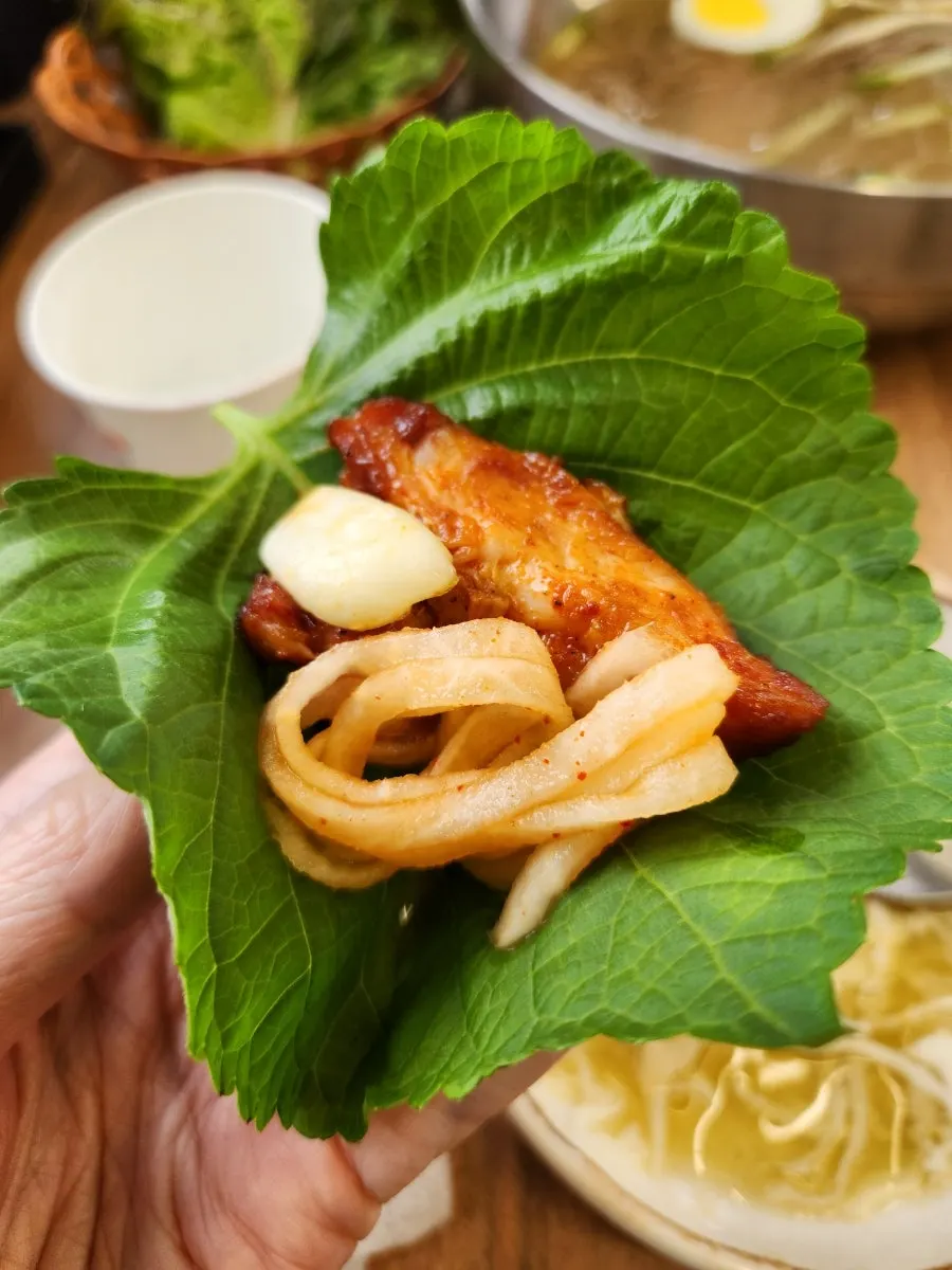 Charcoal dakgalbi wrapped in lettuce