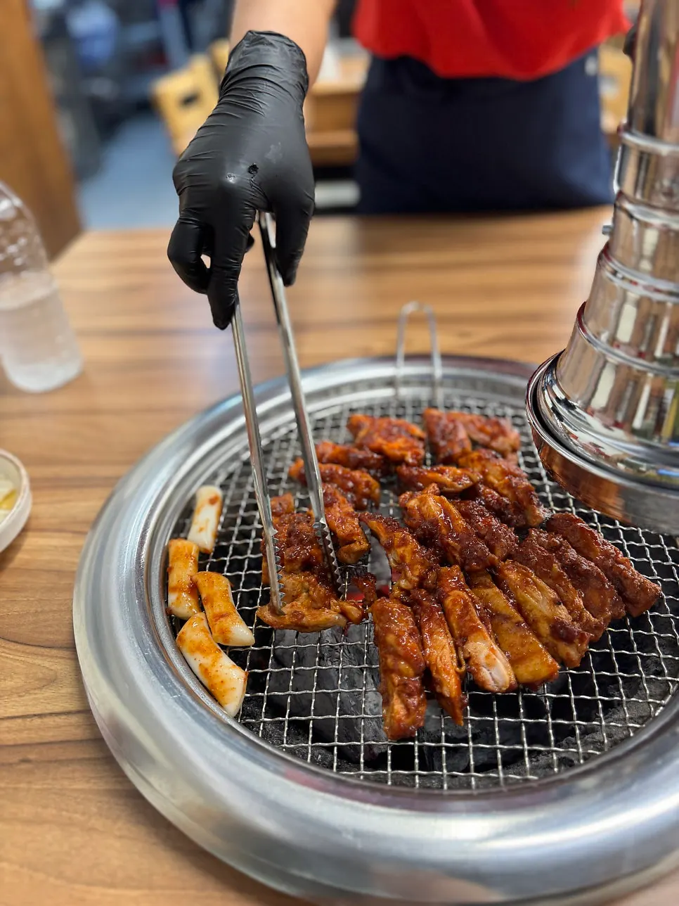 Marinated charcoal dakgalbi cooking on the pan