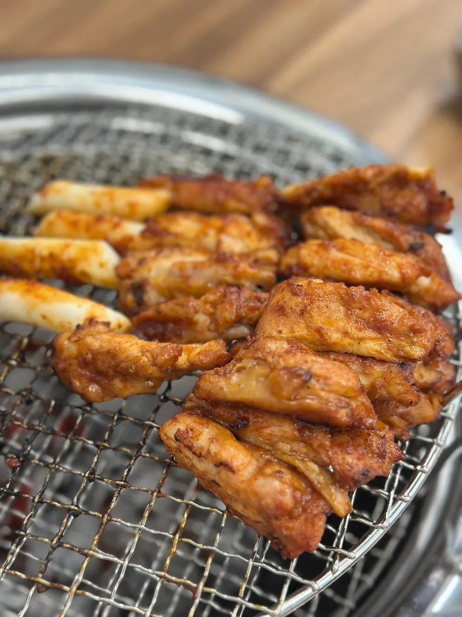 Dakgalbi cooking over charcoal