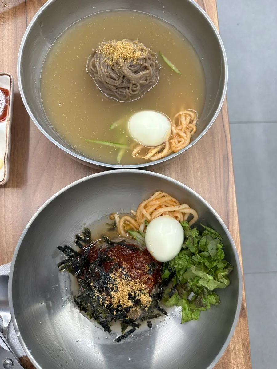 Two bowls of water and bibim makguksu