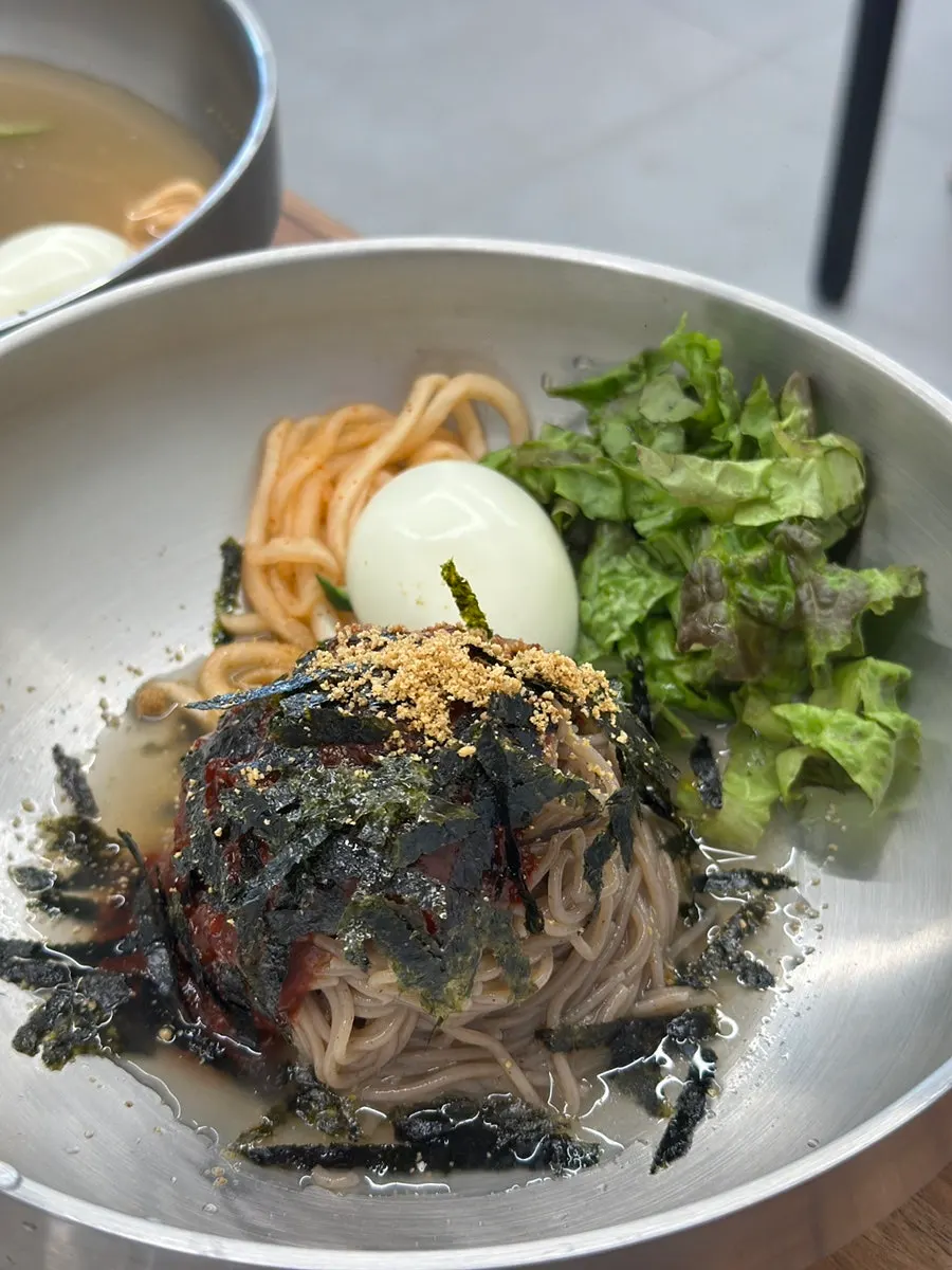 Bibim makguksu topped with sauce