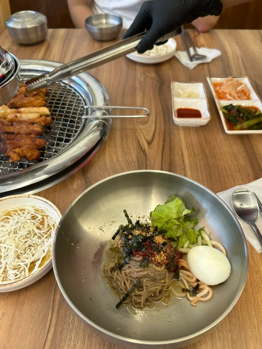 A golden-brown piece of grilled dakgalbi