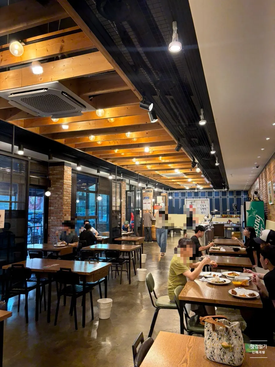 Clean interior of the restaurant with about 15 tables