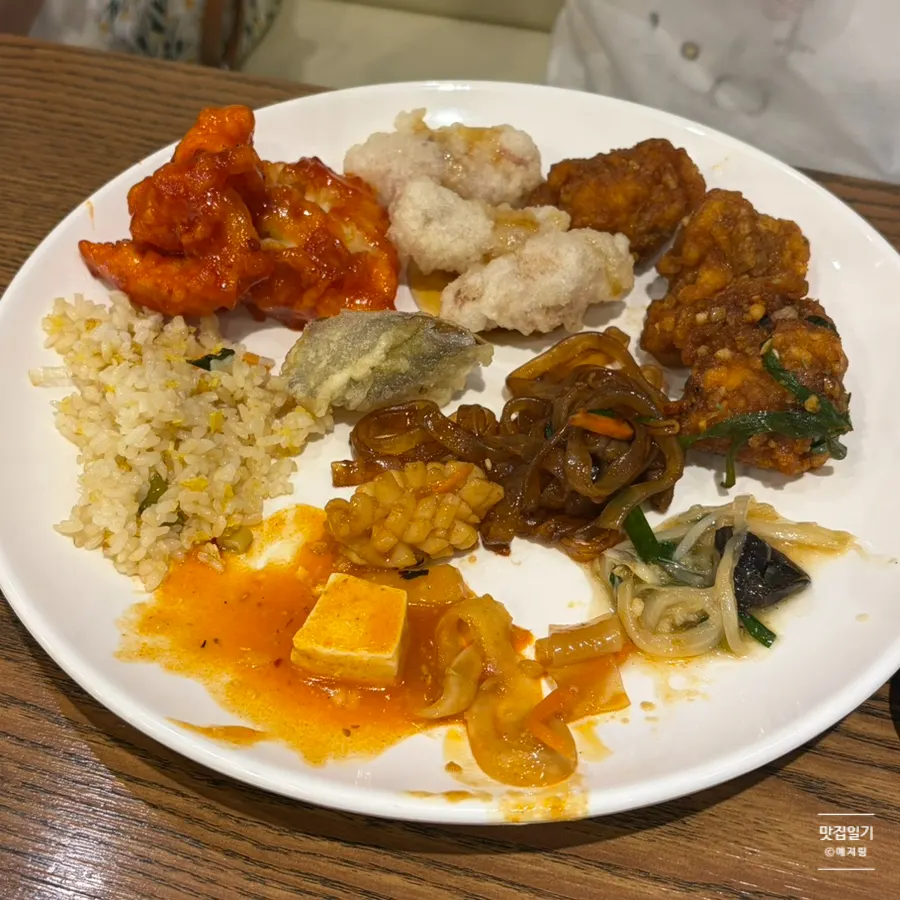 A plate with small portions of tangsuyuk and chili shrimp