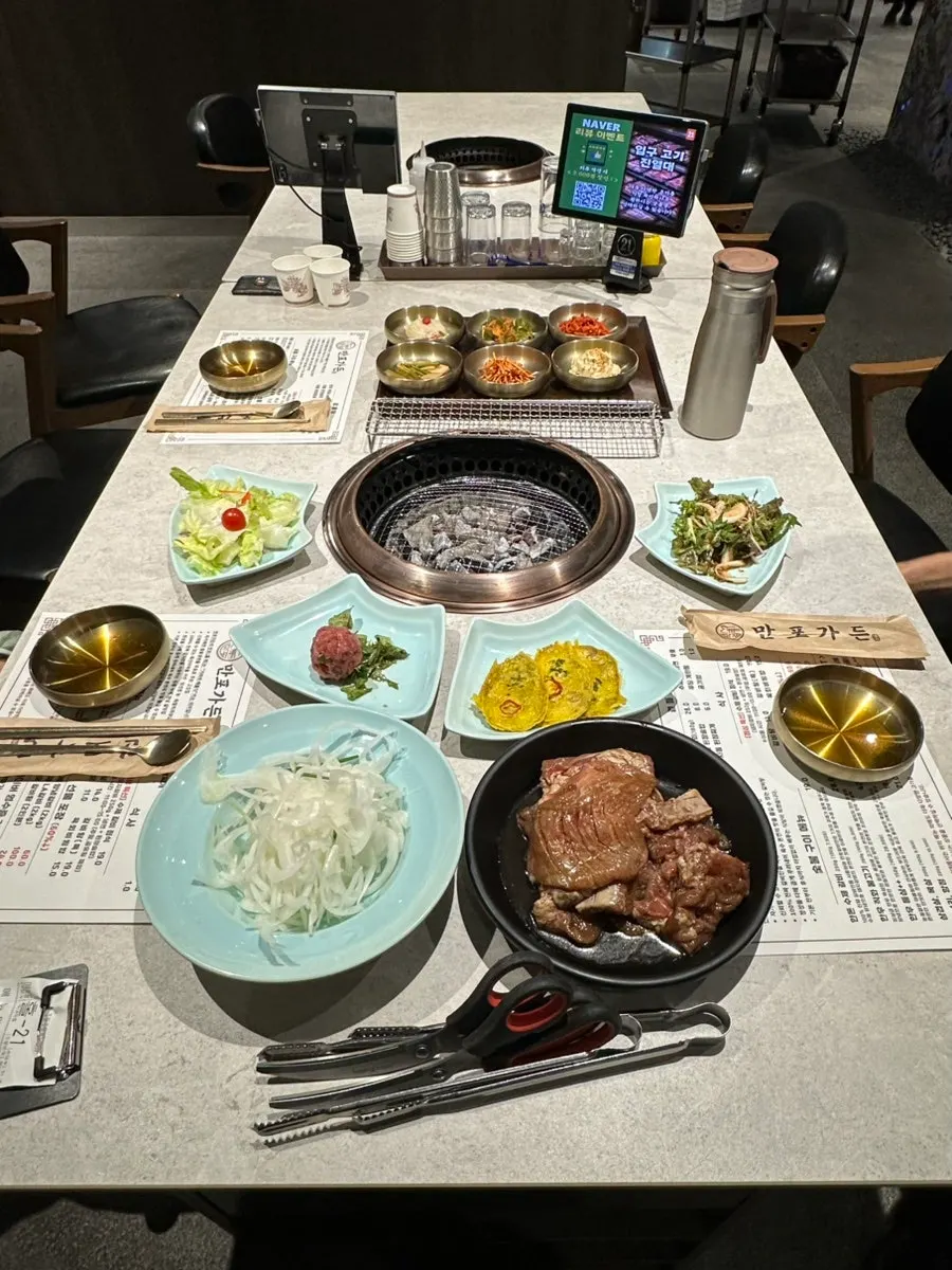Table set with 3 servings of hanwoo-style pork galbi at Manpo Garden